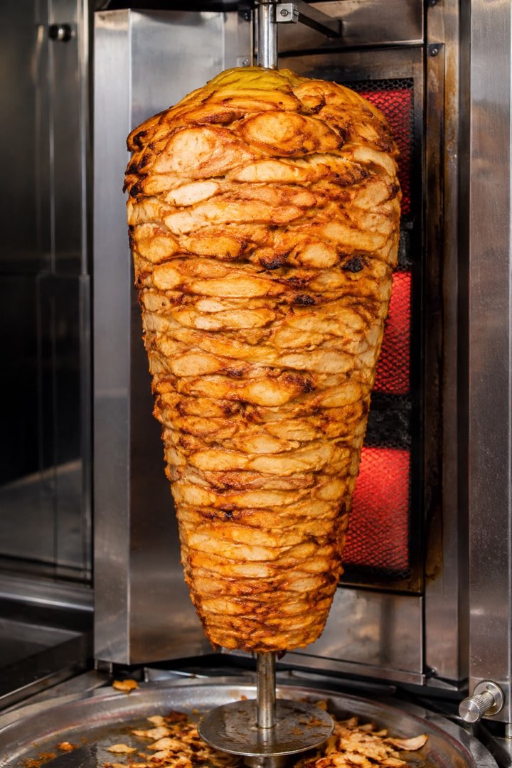 Chicken doner kebab roasting on the spit at Fred's Charcoal Grill, South Molton